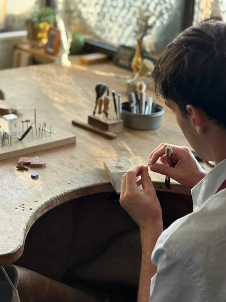 Robin Deriaz working a jewellery piece at the bench